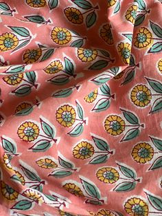 an orange and green floral print fabric