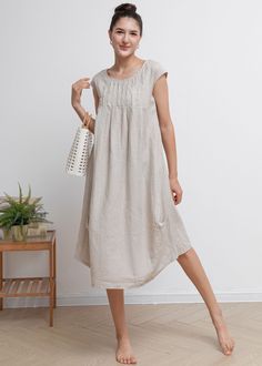 "Smock linen dress featuring in round neckline, pleated waist details, casual loose silhouette. ★★FEATURES 100% Linen Two side pockets Round neckline Short sleeve Pleated waist details Casual dress Mama dress Simple dress Perfect for Summer, Spring ★★ Model Size Height approx 162 cm (5′ 4″) Bust 84 cm (33\") Waist 66 cm (26\") She wears size XS. ★★ Bespoke Order Service If you Request other color Request the length Your height is not between 155 cm- 172 cm Your weight is over 75 kg I can do it f Casual Pleated Linen Dress For Summer, Casual Linen Pleated Dress, Casual Flax Dress For Daywear, Casual Flax Daywear Dress, Casual Flax Color Dress For Daywear, Casual Flax Color Daywear Dress, Casual Beige Dress, Dresses For Short Curvy Figures, Womens Linen Dress