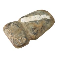 a rock with a white stripe on it that is in the shape of a rectangle