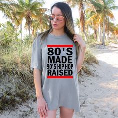 80's Made 90's Hip Hop Raised Tee 90s Inspired Summer Streetwear T-shirt, 90s Slogan T-shirt For Summer, 90s Inspired Printed Tops For Streetwear, 90s Inspired Screen Print Summer T-shirt, 90s Inspired Relaxed Fit Text Print T-shirt, 90s Inspired Relaxed Fit T-shirt With Text Print, 90s Style Pre-shrunk T-shirt For Summer, 90s Inspired Pre-shrunk Summer T-shirt, 90s Inspired Tops With Relaxed Fit And Graphic Printing