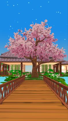 a wooden bridge leading to a tree with pink flowers