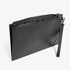 Carry all your most important items in style with this luxurious, leather clutch with embellished with a silver plaque. 100% Leather Luxury Wallets With Zipper Pouch For Evening, Luxury Evening Wallets With Zipper Pouch, Luxury Evening Wallet With Zipper Pouch, Designer Everyday Pouch Clutch, Black Leather Clutch With Zipper Pouch, Designer Clutch Pouch For Everyday, Designer Everyday Clutch Pouch, Luxury Evening Wallet With Zipper Closure, Modern Black Clutch In Soft Leather