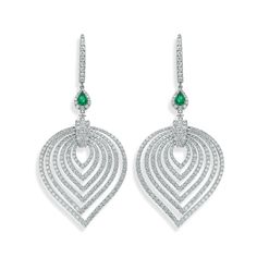 Crafted in 18K white gold, these earrings are pave set with 518 round brilliant cut diamonds. There's a pear shape emerald set that's fixed to the hoop. Timeless Pear-shaped Diamond White Jewelry, Luxury Pear-shaped Diamond Earrings With Gemstones, Pear-shaped Diamond Earrings For Formal Events, Elegant Teardrop Diamond Earrings Fine Jewelry, Elegant Teardrop Diamond Jewelry, Teardrop Diamond Earrings With Elegant Design, Luxury Pear-shaped Teardrop Earrings For Formal Occasions, Teardrop Diamond Accents Fine Jewelry, Elegant Teardrop Diamond Earrings Brilliant Cut