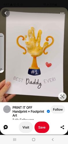 someone is holding up a card with the words best daddy on it and an image of a