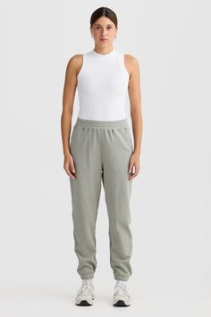 Comfort meets style with the Lena Track Pant Dusty Olive. Crafted from 100% mid weight Terry Cotton, these track pants are a must have addition to your athleisure collection. 100% Cotton French Terry Classic track pant with elasticated waist and design seam detailing Embroidered classic logo Elasticated cuffs Cutaway pockets Sporty Full-length Cotton Pants, Cotton Sweatpants With Elastic Waistband Ankle-length, Sporty 4-way Stretch Ankle-length Activewear Pants, Canterbury Track Pants, Sporty Cotton Pull-on Sweatpants, Track Pants Women, Classic Logo, Track Pants, Blue Sea