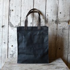 The Marlowe Carryall Eco-friendly Waxed Canvas Tote Bag, Everyday Waxed Canvas Bag With Reinforced Handles, Waxed Canvas Bag For Everyday Use, Rectangular Waxed Canvas Bag, Daily Use Waxed Canvas Bag With Reinforced Handles, Brown Waxed Canvas Bags With Reinforced Handles, Recycled Metal Jewelry, Waxed Canvas Bag, Sustainable Bag