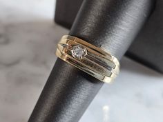 A MENS VINTAGE ESTATE 14K YELLOW GOLD DIAMOND PINKY RING WITH ABOUT A 0.10ct DIAMOND.  THE TOTAL WEIGHT IS 8.8g, AND IS A SIZE 8.0.  RING IS MARKED 14K.   ANY QUESTIONS PLEASE DONT HESITATE TO ASK.  BE SURE TO CHECK OUT SOME OF OUR OTHER GREAT ITEMS UP FOR SALE.  THANK YOU. Mens Estate Rings, Anniversary Wide Band Ring With Single Diamond, Anniversary Rings With Single Diamond In Wide Band, Anniversary Ring With Single Diamond On Wide Band, Solitaire Wide Band Ring For Anniversary, Wide Band Solitaire Ring For Anniversary, Anniversary Wide Band Solitaire Ring, Formal Wide Band Diamond Ring With Single Diamond, Vintage Gold Solitaire Ring