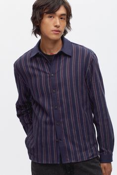 The Abaza Shirt is made from a soft 100% BCI Cotton in a brushed houndstooth patterned fabric featuring our signature stripes. Designed with a regular fit, straight cut hem and made to layer over your favourite t-shirt. Relaxed Fit Yarn-dyed Linen Shirt, Linen Yarn-dyed Relaxed Fit Shirt, Casual Shirt With Vertical Stripes And Shirttail Hem, Classic Striped Linen Tops, Classic Yarn-dyed Tops With Relaxed Fit, Casual Pinstripe Shirt With Spread Collar, Casual Tops With Vertical Stripes And Shirttail Hem, Classic Relaxed Fit Yarn-dyed Shirt, Fall Button-up Shirt With Vertical Stripes