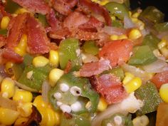 corn, peppers, and bacon are mixed together in a salad that is ready to be eaten