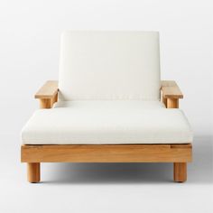 a white chair sitting on top of a wooden frame