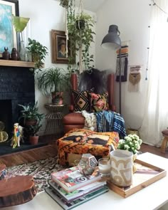 a living room filled with furniture and a fire place