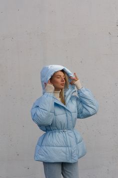 "Oversized short puffer jacket for winter, super warm and cozy. Our puffer jacket is a valuable asset to your wardrobe. It will keep you warm due to its synthetic feathers, which is called \"air feathers\". MEASUREMENTS of THE PUFFER JACKET Jacket length (along the back) 26.7 inches or 68 cm Sleeve length (from the shoulder seam) 22.8 inches or 58 cm shoulder length 6 inches or 15 cm width in the bust area is 24.8 inches or 63 cm SIZES 1 universal size, fits women of S-M sizes M BUST up to 39 in Blue Puffer Jacket With Adjustable Hood For Cold Weather, Light Blue Puffer Jacket, Blue Hooded Puffer Jacket, Luxury Blue Winter Puffer Jacket, Blue Hooded Functional Puffer Jacket, Short Puffer Jacket, Blue Puffer Jacket, Winter Puffer Jackets, Blue Puffer