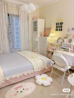 a bedroom decorated in pastel pink and white with an animal rug on the floor