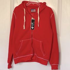 This Is A Nwt Red Hoodie With White Contrast Stitching Please Note One Side Of Drawstring Is Not Woven Correctly. Super Duper Soft Pockets And Full Zip Size Medium Unisex Red Cotton Hoodie With Double-lined Hood, Red Cotton Sweatshirt With Double-lined Hood, Casual Red Hooded Jacket For Streetwear, Casual Red Hoodie With Double-lined Hood, Red Casual Hoodie With Double-lined Hood, Red Sporty Cotton Hooded Jacket, Sporty Red Cotton Hooded Jacket, Casual Red Hoodie With Adjustable Hood, Red Casual Hoodie With Adjustable Hood