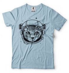 "Astronaut Cat T-Shirt Funny Creative Stylish Cool Graphic Humor Cat Shirt This ULTRA COTTON UNISEX T-shirt is made of Pre-shrunk 100% cotton, 6.1-ounce. * Seamless double-needle 7/8\" collar, Double-needle sleeves and hem, Taped neck and shoulders Our T Shirts and Hoodies are Printed by advanced technology Digital Printer on 100% Ultra Cotton tees and hoodies . We use waterbased textile ink, Safest ink type for everyone. Each T shirt is Made individually and double checked for quality before se Relaxed Fit Crew Neck T-shirt With Cat Print, Relaxed Fit Cat Print T-shirt With Crew Neck, Crew Neck Cotton Shirt With Cat Design, Cotton Crew Neck Shirt With Cat Design, Blue Crew Neck T-shirt With Cat Design, Cotton T-shirt With Cat Design, Relaxed Fit, Blue Cotton Top With Cat Print, Funny Astronaut, Cool Tee Shirts