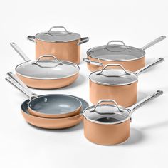 a set of pots and pans with lids