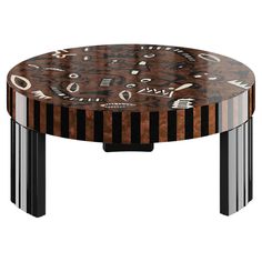 an artistically designed coffee table with black and brown stripes on the top, surrounded by other decorative objects