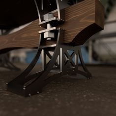 a wooden bench with metal legs and a clock on it