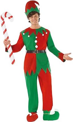 a man dressed in an elf costume holding a candy cane