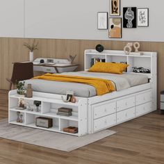 a white bed sitting on top of a wooden floor