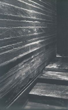 an old photo of some wooden steps in a room with no one on the floor