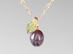 an image of a necklace with fruit on it