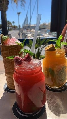 three different types of drinks on a table