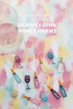 some wine glasses and bottles on a table with the words shrinky - dink wine charms