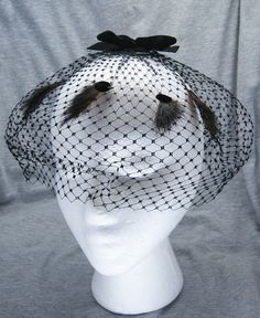 This is a Vintage Woman's Black Hairnet with Black Velvet Bow, Velvet Dot and Fur Accents. Net is in good vintage condition. Please see photos for conditions. Has been stored on oval shaped tissue paper. Do not know what type of fur is used in the accents. A very nice retro look. Thanks for looking and will consider offers. Black Retro Fascinator For Vintage Events, Black Vintage Fascinator, Cage Headpiece, Large Brim Hat, Black Velvet Bow, Types Of Hats, Coat Men, Velvet Bow, Velvet Ribbon