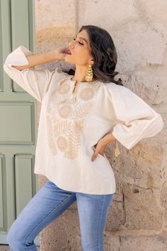 This Beautiful Mexican 3/4 length sleeve blouse is comfortable and stylish. It has beautiful Hand embroidered flowers.  Please Note: This blouse is hand embroidered and the details may vary from piece to piece. This blouse comes in one size which fits sizes Small and Medium. Embroidered Long Sleeve Cream Blouse, Spring Blouse With Floral Embroidery And 3/4 Sleeves, Traditional Long Sleeve Tops With Tonal Embroidery, Beige Folk Style Long Sleeve Tops, Spring Floral Embroidered Half Sleeve Top, Beige Long Sleeve Folk Top, Cotton Embroidered Top With 3/4 Sleeves, Bohemian Half-sleeve Blouse With Floral Embroidery, Bohemian Tops With 3/4 Sleeve And Floral Embroidery