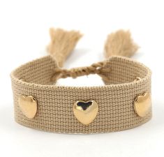 Crafted with an adjustable woven wristband, this bracelet features golden heart-shaped metal rivets and a decorative tassel that is sure to make your girls trip, girls weekend or girls getaway unforgettable. Thoughtful and trendy, this bracelet makes the perfect gift for your bridal party. A sweet gift for your rehearsal dinner, wedding weekend or bachelorette trip gift! Please make any requests known to me in the box provided at the check out window! This listing is for:1 woven thread bracelet Trendy Gold Friendship Bracelets For Valentine's Day, Resizable Gold Friendship Bracelets For Summer, Casual Gold Braided Bracelets For Festivals, Trendy Gold Braided Bracelet With Adjustable Length, Casual Gold Friendship Bracelets For Festival, Gold Woven Bracelets For Friendship, Gold Woven Braided Bracelets For Beach, Trendy Gold Friendship Bracelets For Festival, Gold Braided Bracelets For Beach