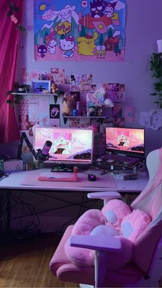 two computer monitors sitting on top of a desk in front of a pink chair with stuffed animals