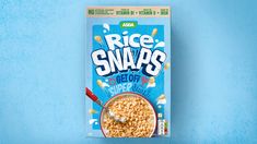 a package of rice snaaps on top of a blue surface with a spoon in it