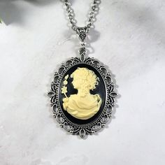 This beautiful goddess cameo necklace is the perfect way to show your love for mythology in an elegant way. This necklace features Greek goddess Persephone. Persephone is the goddess of spring and queen of the underworld. This artwork presents her in her spring maiden aspect. Available in a variety of lengths. Chain is stainless steel. Secured with a lobster clasp. All materials are lead and nickel free. Frame and chain are made out of zinc alloy. Cameo piece is made from resin. Frame may vary s Gothic Cameo Necklace As Gift, Gothic Cameo Necklace For Gift, Gothic Cameo Necklaces For Gifts, Gothic Cameo Necklaces As Gift, Greek Goddess Persephone, Goddess Persephone, Goddess Of Spring, Witchy Necklace, Gothic Witch