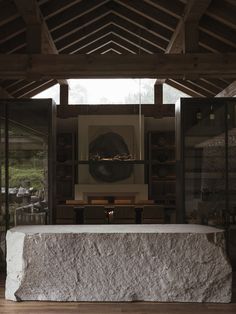 a room with a large stone table in it