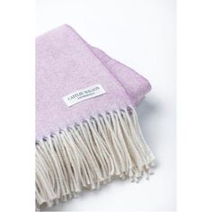 a purple and white blanket with a label on it that says,'cotton & wool '