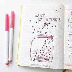 an open notebook with valentine's day written on it and two markers next to it