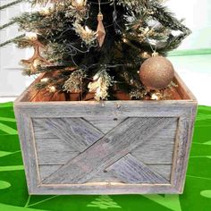 a small christmas tree in a wooden box