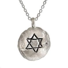 Description and Details Wear the Star of David close to your heart with this stunning, hand-sculpted pendant, which is imprinted with texture from stones of the Western Wall in Jerusalem. The sterling silver pendant hangs on a 16” traditional chain for a beautiful look that can be worn every day, or layered with your other favorite necklaces. Pendant 5/8″ (14mm) Sterling silver circle pendant Star of David engraving Imprint with texture from the stones of the Western Wall in Jerusalem Chain leng Symbolic Hand Forged Pendant Necklace, Spiritual Star Charm Pendant Jewelry, Engraved Sterling Silver Star Of David Necklace, Artisan Necklace With Round Pendant, Symbolic Star Of David Engraved Necklace, Artisan Hand Cast Necklace With Round Pendant, Celestial Hand Forged Necklace Gift, Hand Cast Amulet Pendant Necklace, Sterling Silver Star Of David For Jewelry Making