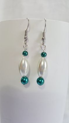 These simple but elegant earrings and the perfect completion for a night out. Turquoise Pearl Drop Earrings, Turquoise Earrings For Evening, Elegant Turquoise Pearl Drop Earrings, Elegant Turquoise Beaded Earrings For Gift, Elegant Green Hypoallergenic Beaded Earrings, Elegant Turquoise Hoop Earrings, Elegant Hypoallergenic Beaded Drop Earrings, Elegant Handmade Turquoise Hoop Earrings, Elegant Turquoise Beaded Earrings For Party