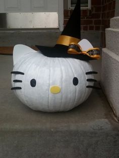 a hello kitty pumpkin sitting on the ground