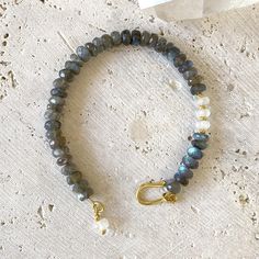 by Robindira Unsworth Handmade at our design studio in California 22k gold vermeil Labradorite, moonstone Length: 7.5" Style No. B415-G-LAB Everyday Labradorite Jewelry With Gemstone Beads, Handmade Gold Moonstone Beaded Bracelets, Gold Beaded Bracelets With Moonstone, Gold Moonstone Bracelets With Natural Stones, Bead Bracelet Design Ideas, Handmade Artisan Labradorite Bracelets, Gemstone Bracelets Ideas, Gold Labradorite Bracelets With Natural Stones, Gold Labradorite Bracelet With Natural Stones