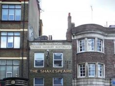 an old brick building with the words shakespeare written on it's front and side