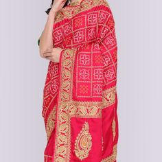 Introducing the Bandhani Print Gharchola in Red! This beautiful gharchola is made from pure gaji silk and features an exclusive bandhani print and gota work pallu. The bandhani print is traditional Indian tie-dyeing technique that is used to create intricate patterns on fabric. The result is a stunning piece of art that is perfect for any occasion. The gharchola is a traditional Indian garment that is worn by women of all ages. It is easy to wear and can be dressed up or down depending on the oc Red Bandhani Print Unstitched Saree, Red Bandhani Print Saree For Diwali, Red Saree With Bandhani Print, Red Bandhani Print Art Silk Saree, Red Bandhani Print Traditional Drape, Semi-stitched Red Choli With Bandhani Print, Red Chanderi Saree With Bandhani Print, Red Bandhani Print Traditional Wear, Red Bandhani Traditional Wear