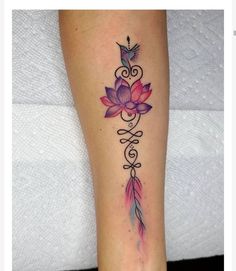 a woman's leg with a tattoo on it and a bird flying over the flower