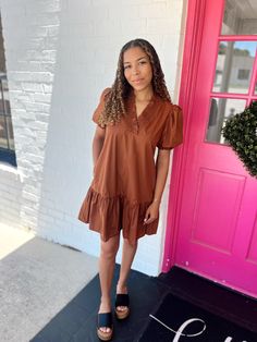 A pretty caramel dress that is simple and solid but has the prettiest details with the ruffles and key hole in the back. Just a stunner for anyone and everyone!!! Brown V-neck Dress With Ruffle Hem, Brown Ruffled Midi Dress, Brown V-neck Midi Dress With Ruffles, Brown V-neck Ruffled Midi Dress, Brown Ruffled Mini Dress With Short Sleeves, Brown Ruffle Hem Dress For Day Out, Brown Ruffle Hem Dress, Brown Ruffled Short Sleeve Mini Dress, Brown Mini Dress With Ruffles And Short Sleeves