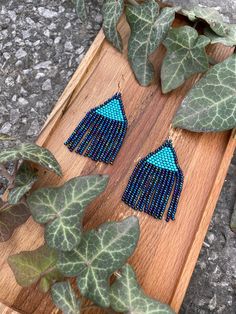 Royal shiny blue beaded earrings - Indigo small dangle earrings - Feather seed bead earrings - Native style earrings - Boho/bohemian/ethnic ♥𝑇ℎ𝑒 𝑝𝑎𝑡𝑡𝑒𝑟𝑛 𝑜𝑓 𝑡ℎ𝑖𝑠 𝑒𝑎𝑟𝑟𝑖𝑛𝑔 𝑖𝑠 𝑐𝑟𝑒𝑎𝑡𝑒𝑑 𝑏𝑦 𝐾𝑎𝑍𝑒𝐵𝑒𝑎𝑑𝐽𝑒𝑤𝑒𝑙𝑟𝑦 ♥𝑀𝑎𝑑𝑒 𝑢𝑠𝑖𝑛𝑔 𝑓𝑟𝑒𝑒ℎ𝑎𝑛𝑑 𝑏𝑒𝑎𝑑𝑖𝑛𝑔 𝑤𝑜𝑣𝑒𝑛 𝑡𝑒𝑐ℎ𝑛𝑖𝑞𝑢𝑒𝑠 𝑤𝑖𝑡ℎ 𝑠𝑡𝑟𝑜𝑛𝑔 𝑠𝑦𝑛𝑡ℎ𝑒𝑡𝑖𝑐 𝑡ℎ𝑟𝑒𝑎𝑑. ♥𝑇ℎ𝑒 𝑠𝑖𝑧𝑒 𝑜𝑓 𝑡ℎ𝑒 𝑠𝑒𝑒𝑑 𝑏𝑒𝑎𝑑𝑠 𝑢𝑠𝑒𝑑 𝑖𝑠 2 𝑚𝑖𝑙𝑙𝑖𝑚𝑒𝑡𝑒𝑟𝑠 𝑎𝑛𝑑 𝑏𝑒𝑎𝑑𝑠 𝑎𝑟𝑒 ℎ𝑖𝑔ℎ 𝑞𝑢𝑎𝑙𝑖𝑓𝑖𝑒𝑑. ♥𝐴𝑙𝑙 𝑡ℎ𝑒 ℎ𝑜𝑜𝑘𝑠 𝑢𝑠𝑒𝑑 𝑖𝑛 𝑜𝑢𝑟 𝑗𝑒𝑤𝑒𝑙𝑟𝑦 𝑎𝑟𝑒 24 𝑘 𝑔𝑜𝑙𝑑 𝑝𝑙𝑎𝑡𝑒𝑑 𝑎𝑛𝑑 ℎ𝑦𝑝𝑜𝑎𝑙𝑙𝑒𝑟𝑔𝑒𝑛𝑖𝑐. ♥𝑇ℎ𝑒𝑠𝑒 𝑎𝑟𝑒 𝑣𝑒𝑟𝑦 𝑙𝑖𝑔ℎ𝑡 𝑒𝑎𝑟𝑟𝑖𝑛𝑔𝑠 𝑡ℎ𝑎𝑡 𝑦𝑜𝑢 𝑐𝑎𝑛 𝑤𝑒𝑎𝑟 𝑎𝑙𝑙 𝑑𝑎𝑦 𝑤𝑖𝑡ℎ𝑜𝑢𝑡 ℎ𝑢𝑟𝑡𝑖𝑛𝑔 𝑦𝑜𝑢𝑟 𝑒𝑎𝑟! The on Blue Tassel Earrings For Festivals, Blue Tassel Drop Earrings For Festival, Blue Bohemian Beaded Earrings For Pierced Ears, Blue Bohemian Earrings With Dangling Beads, Bohemian Blue Earrings With Dangling Beads, Unique Blue Earrings For Festival, Turquoise Earrings With Tiny Beads For Festivals, Festival Turquoise Earrings With Tiny Beads, Blue Beaded Drop Earrings For Festival