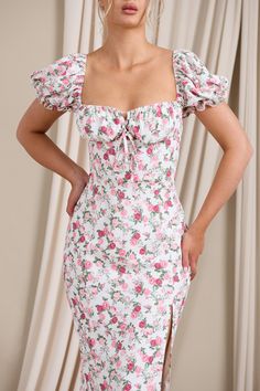 Inspired by romantic Italian summers. Two Scoops is a delicate floral dress designed in a woven fabric that's luxuriously lightweight. This midi dress frames your feminine features with a sweetheart neckline. short puff sleeves and a structured corset that laces from behind.Features - Premium woven fabric - Sweetheart neckline - Wired cups - Short puff sleeves - Boned corset bodice - Self-tie lace closure - Invisible zip closure - Split hemline - Midi length Sizing & FitModel is 5'8 wearing Size Feminine Puff Sleeve Dress With Ruffles For Garden Party, Fitted Floral Print Puff Sleeve Dress For Brunch, Brunch Floral Print Fitted Puff Sleeve Dress, Fitted Puff Sleeve Dress With Floral Print For Brunch, Feminine Square Neck Mini Dress For Brunch, Floral Print Puff Sleeve Dress With Fitted Bodice, Puff Sleeve Dress With Floral Print And Fitted Bodice, Fitted Puff Sleeve Floral Dress For Brunch, Spring Floral Dress With Gathered Sleeves For Garden Party