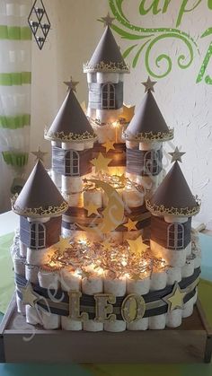 a cake made to look like a castle with lots of lights on it's sides