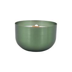 a green bowl with a candle in the center on a white background, there is no image here to provide a caption for